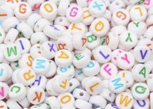 White bead w/ Multicolor letter