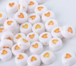 White bead w/ Yellow Heart